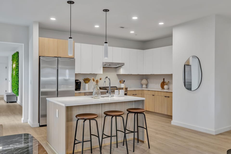 Big kitchen with stainless steel appliances and lots of room to move around.