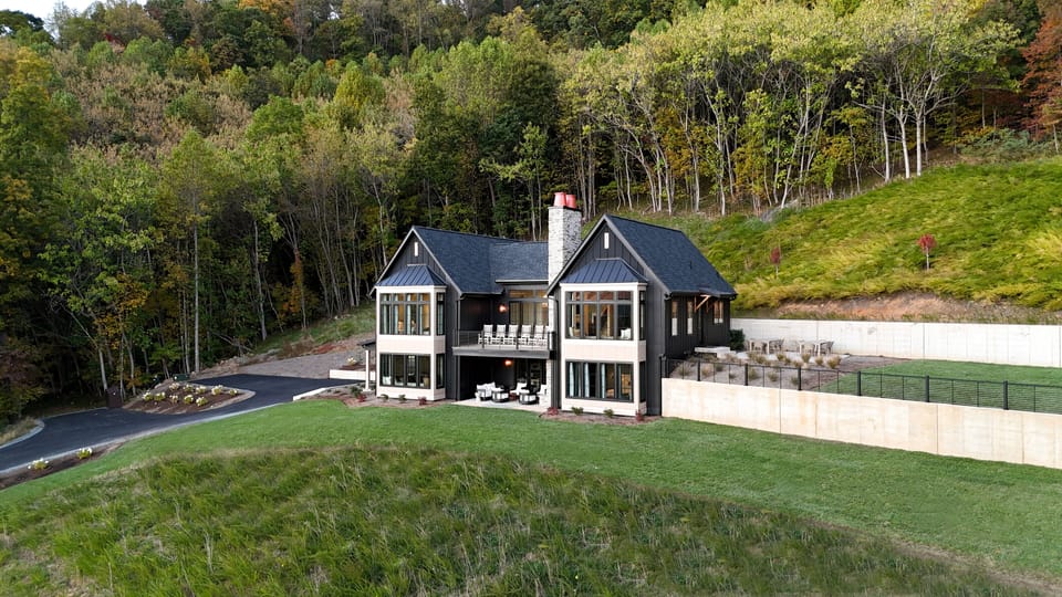 The beautiful exterior of the home faces an incredible view.