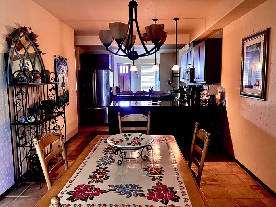 Beautiful dining room with adjoining kitchen and bar.