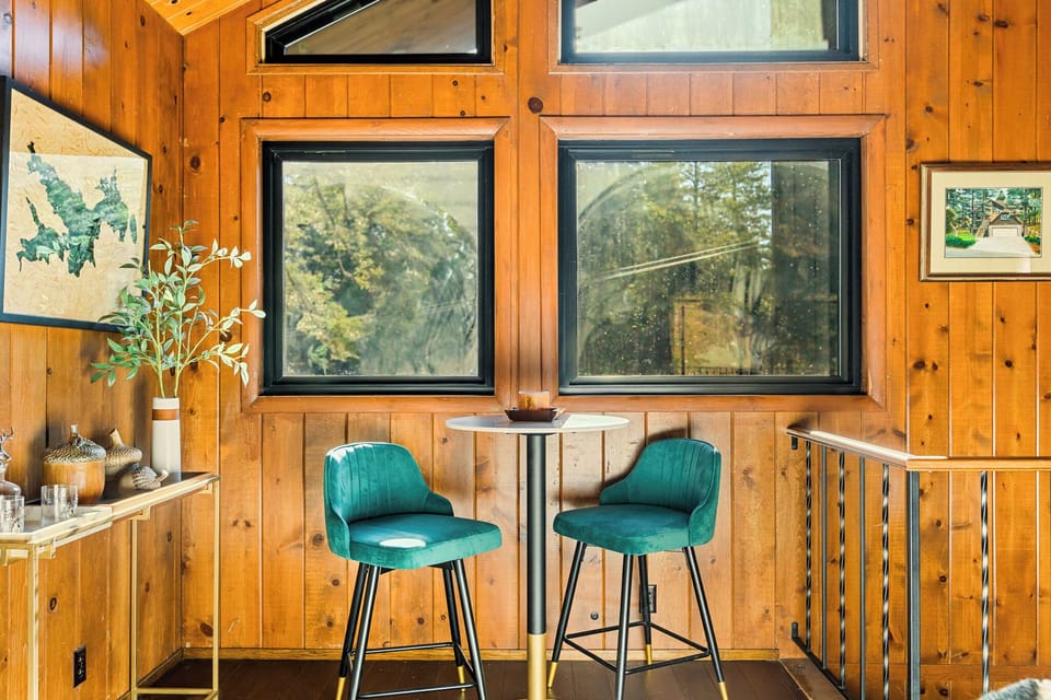 Adjacent to the main living room, there's a quaint seating area where you can unwind with a glass of chilled whisky or uncork a bottle of wine.