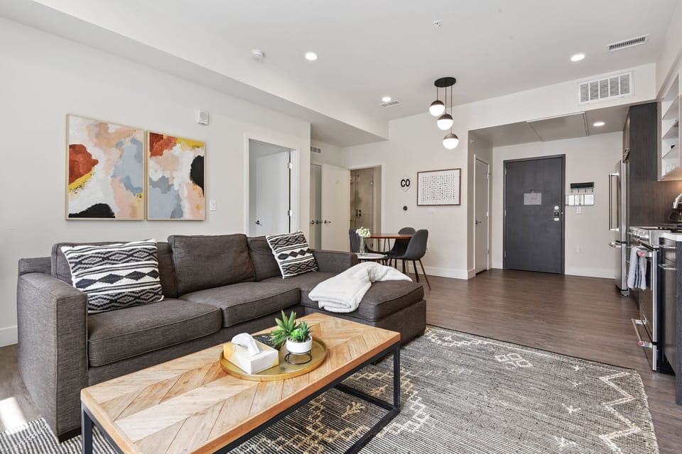 Full view of the living space at EcoLoft Retreat — open layout, large windows, and contemporary eco-forward design.