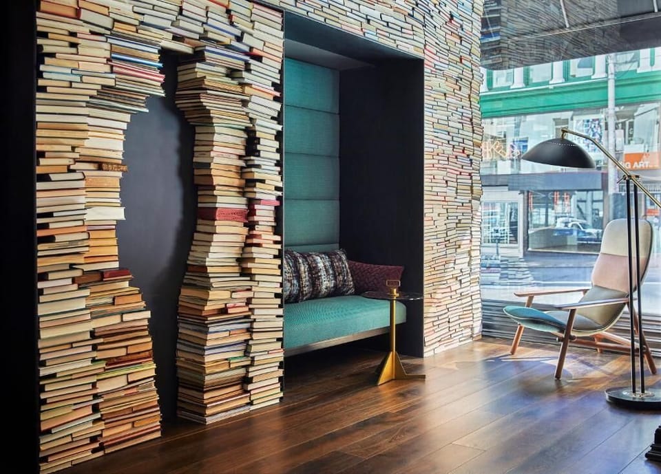 Curl up in a cozy reading nook framed by books.