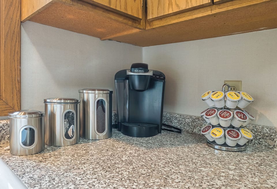 Regular drop coffee maker with ground coffee and filters, sugar and tea