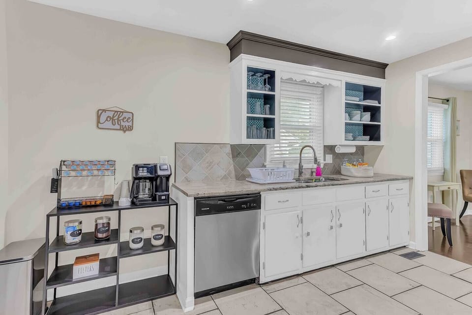 Stainless steel appliances and fully stocked coffee bar