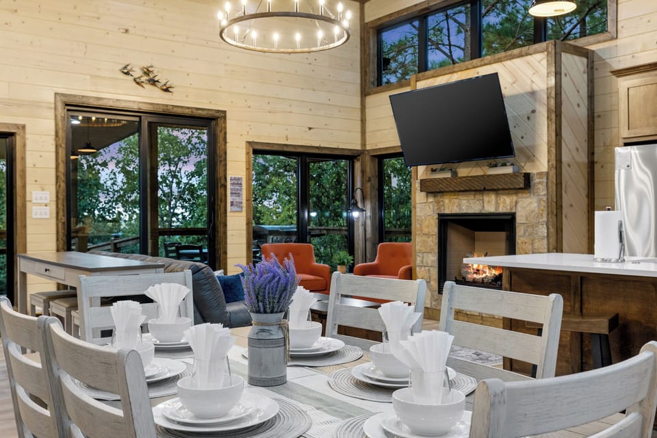 Indulge in meals and entertainment with a kitchen table that offers both a great view and a TV.