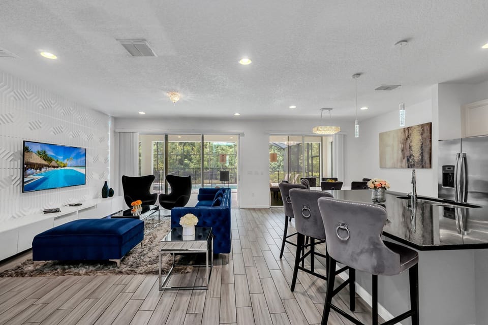 Full view of the living and dining area, highlighting open concept and ample natural light.