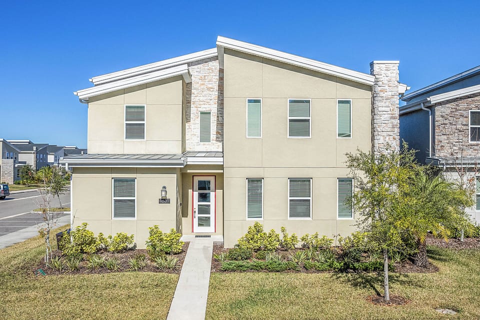 - Contemporary vacation rental exterior with fresh design  
- Beautiful landscaping welcomes you to your Orlando stay  
- Spacious family home close to top Florida attractions