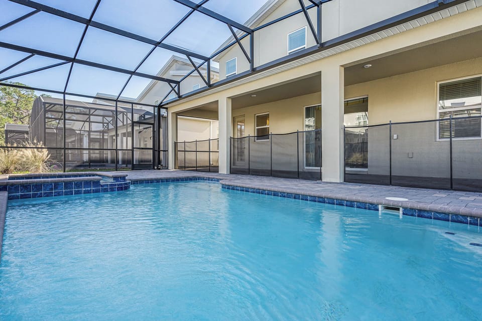 - Private screened pool with safety fence for families  
- Spacious covered patio area for outdoor relaxation  
- Orlando vacation rental perfect for group getaways