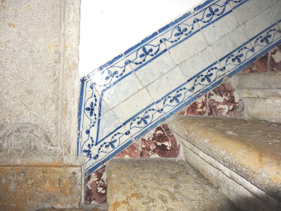The building has a beautiful tiled stairwell