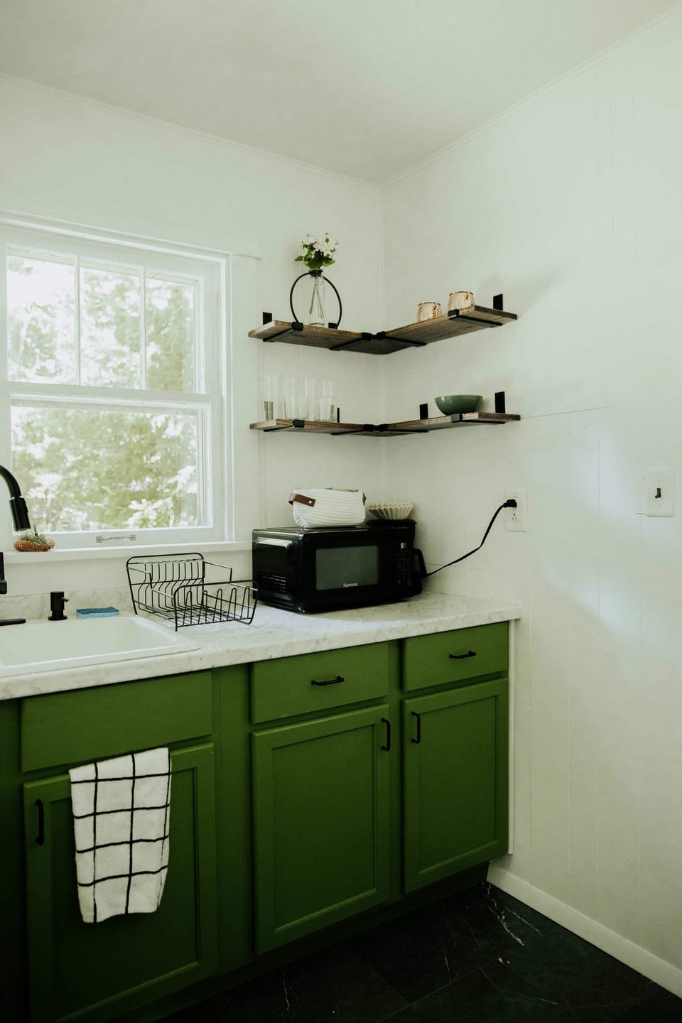 Kitchen: Whip up culinary delights in our vibrant kitchen, accented with stylish open shelving!