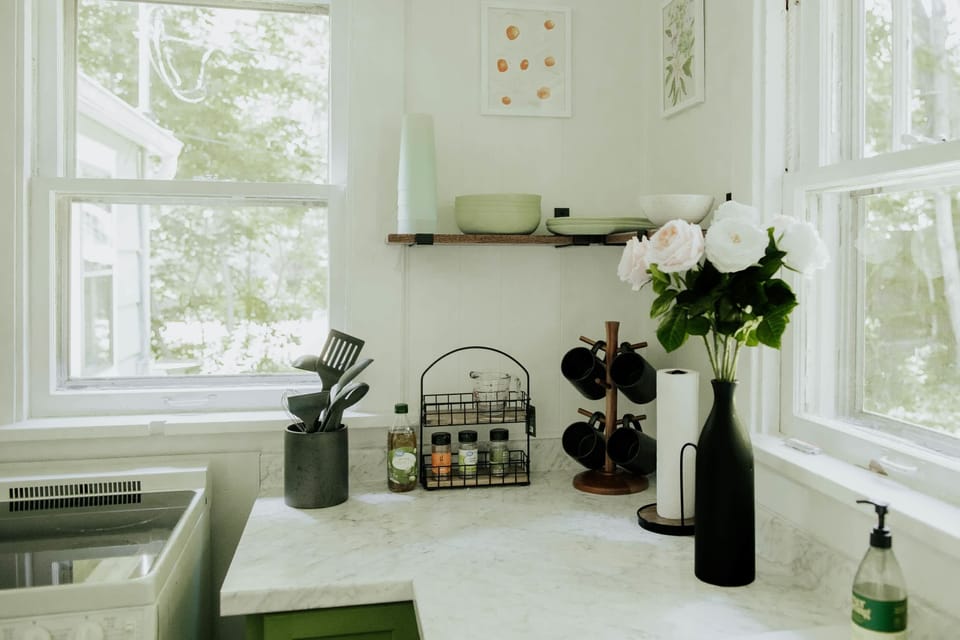 Kitchen: Bright space with lush views, modern decor, and all the essentials for culinary adventures!
