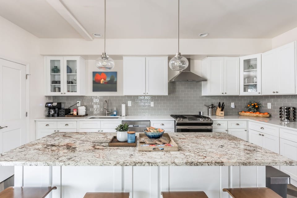Our kitchen features bar seating, modern appliances, a coffee station, a welcome basket with goodies, and all the basic essentials needed for your stay!