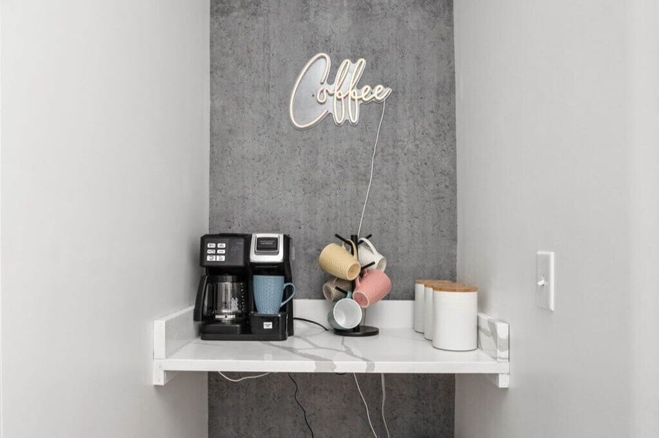 Indulge in the charm of our delightful coffee corner, lovingly crafted for your moments of coffee creation and savoring.