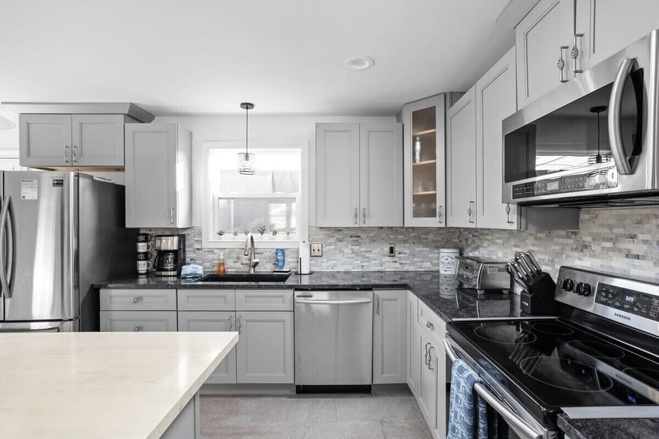 Kitchen: Whip up culinary delights in this stylish space with sleek finishes and modern appliances