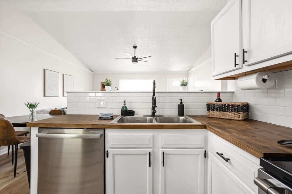 We have a sink, dishwasher, cabinets, paper towels, and essential kitchen items in our kitchen for your convenience. Please feel free to utilize these amenities throughout your stay.