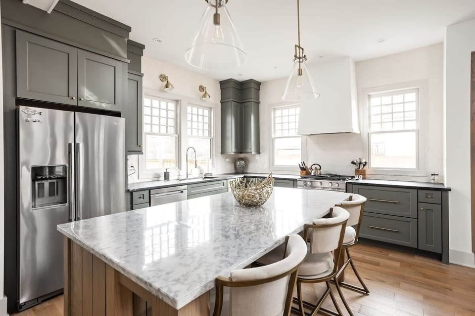 Kitchen: Whip up culinary delights in this elegant kitchen with stunning marble countertops!