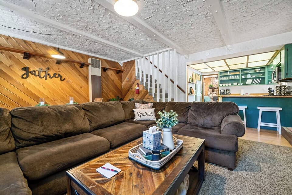 The open concept floor plan, large sectional, coffee table and dining table are perfect for entertaining