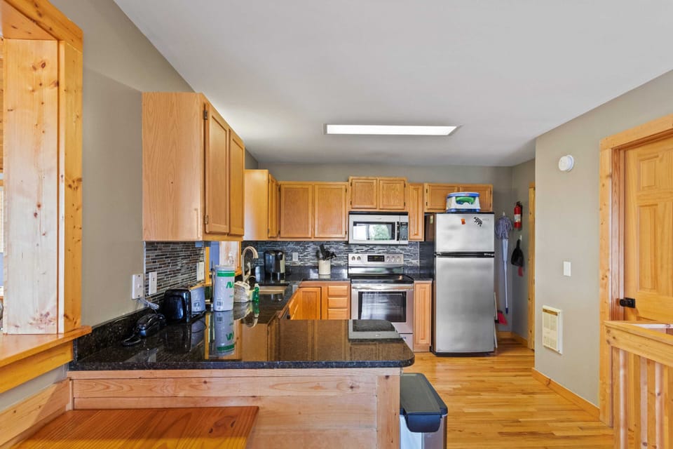 Kitchen with Granite Countertops and Stainless Steel Appliances