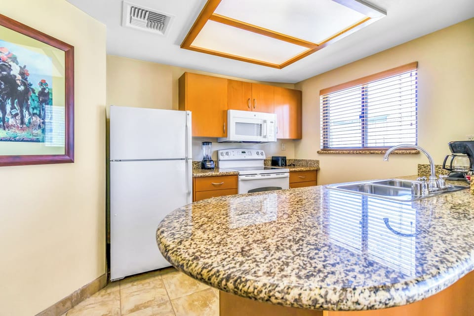 Gather around the glossy breakfast bar for snacks and plans.