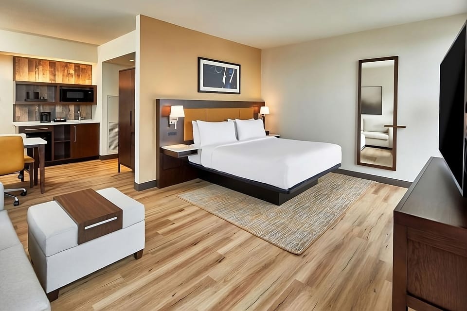 Unwind in a spacious studio suite with crisp linens.