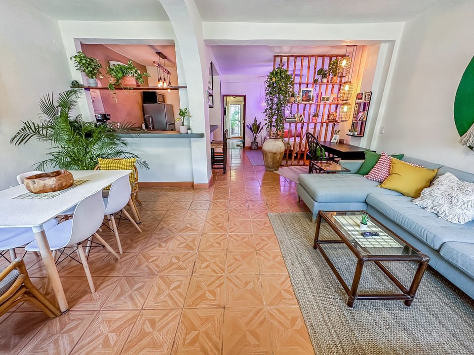 6-seat dining area and living area with 4-seat sofa with chaise