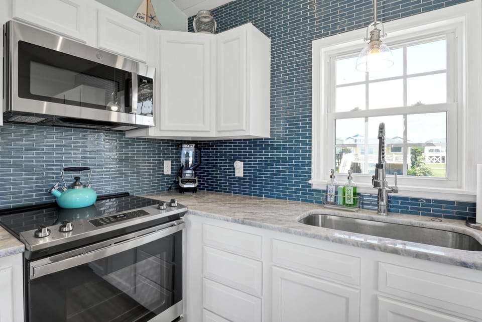 Fully stocked kitchen with stainless steel appliances