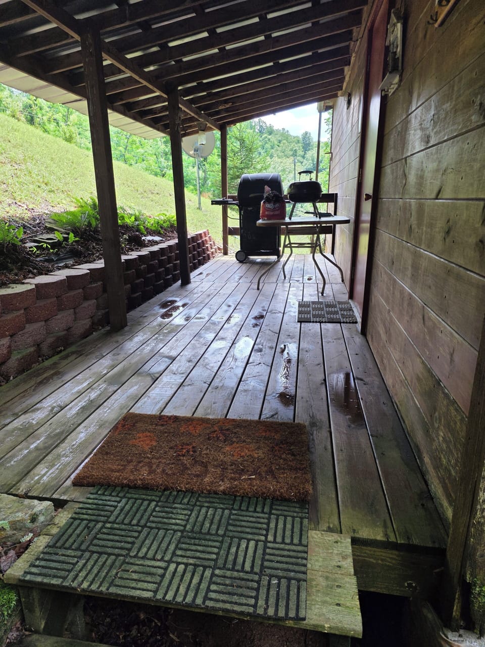 back porch gas grill and a charcoal grill