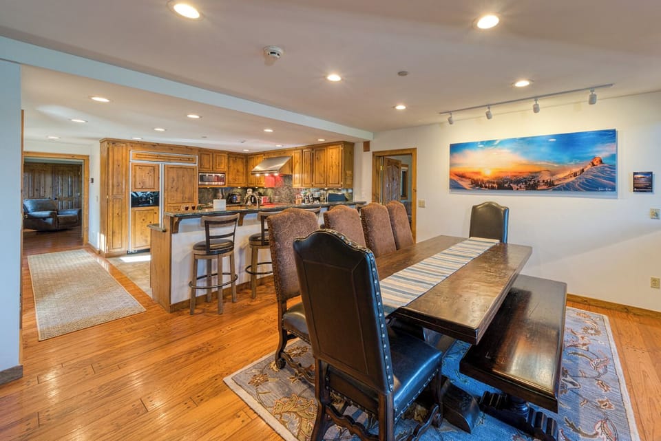 The main dining and kitchen area as you come down the stairs.