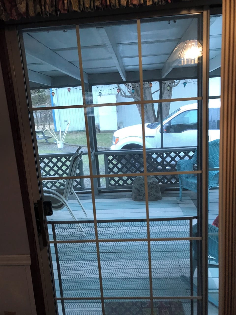 View of back screened in porch from inside kitchen