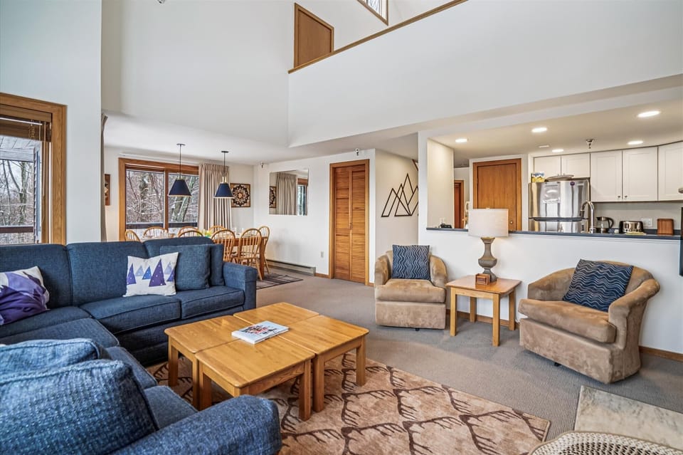 Comfortable seating flows seamlessly into the kitchen and dining area, making it perfect for relaxing or spending time together.