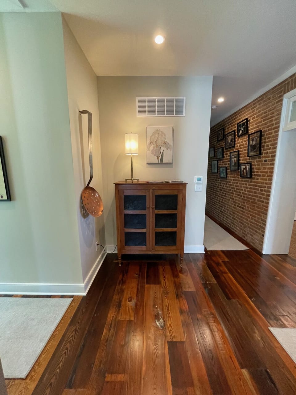 Nook off the kitchen and hallway leading to main floor master bedroom
