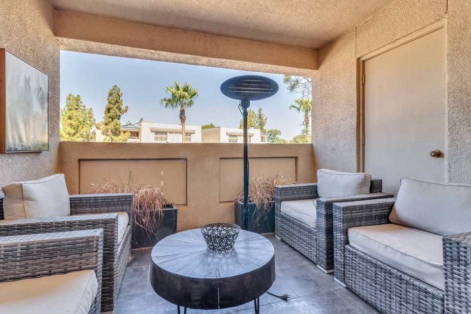 Balcony just off the living room & guest bedroom with outdoor seating