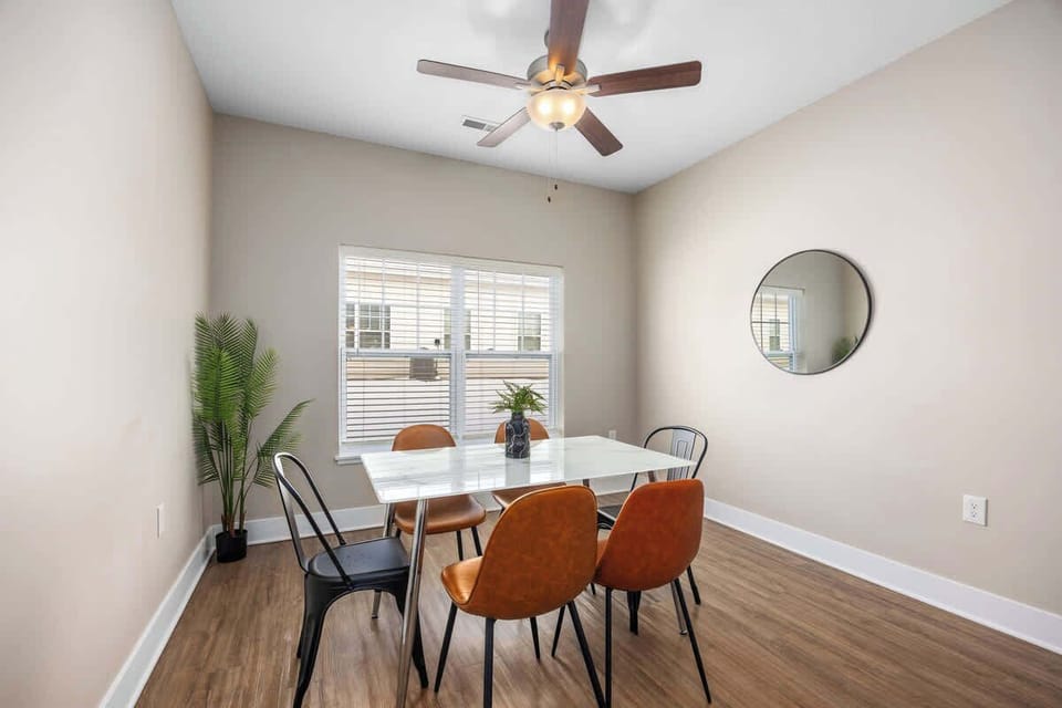 Inviting dining area with ceiling fan — ideal for family meals or entertaining guests.