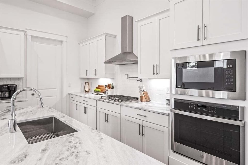 Well-equipped kitchen, featuring upscale appliances and sleek countertops