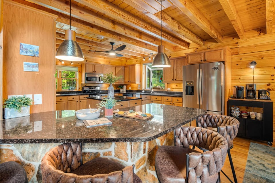 Share snacks and stories at the generous kitchen island, the perfect spot for mornings, mingling, or helping with meal prep.