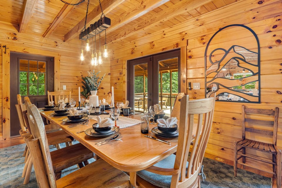Share meals and laughter around the handcrafted dining table, set for celebration and stories. From here you can step right outside to the covered patio for fresh-air dining in the mountains.