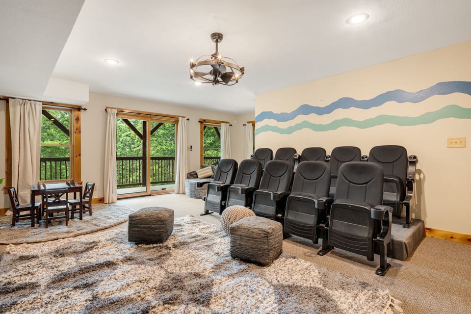 With playful mural art and flexible seating, this theater room on the lower level is perfect for gathering after a day of adventure. Just steps away, the game room offers even more fun for your group.