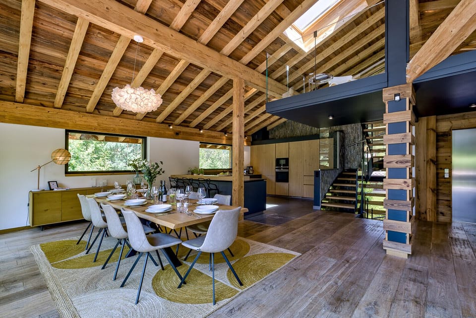 Stairs from living area lead to glass-sided mezzanine