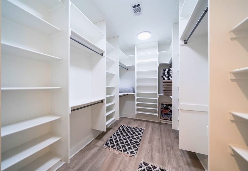 [Primary Bedroom] Unpack and Make yourself at Home in the Large Closet. Perfect for Storing your Suit Cases too!