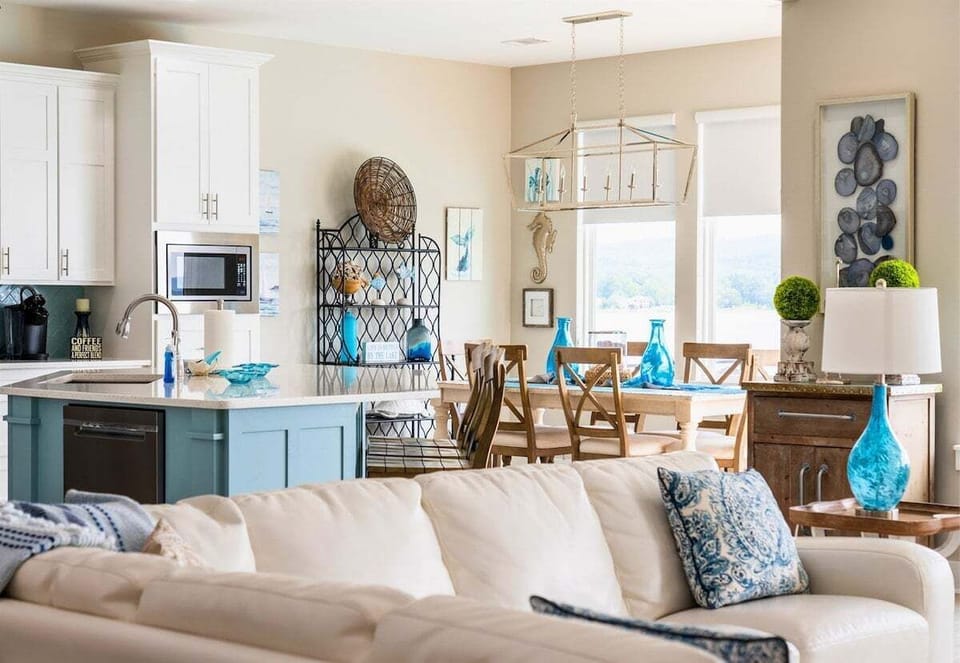 [Living Room] The Living Area Filled with Shades of Blue is Comfortable and has a Large Amount of Seating Options.
