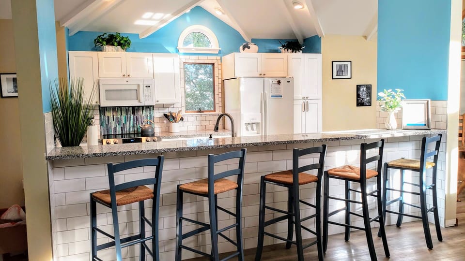 Soaring ceilings - very well stocked kitchen.