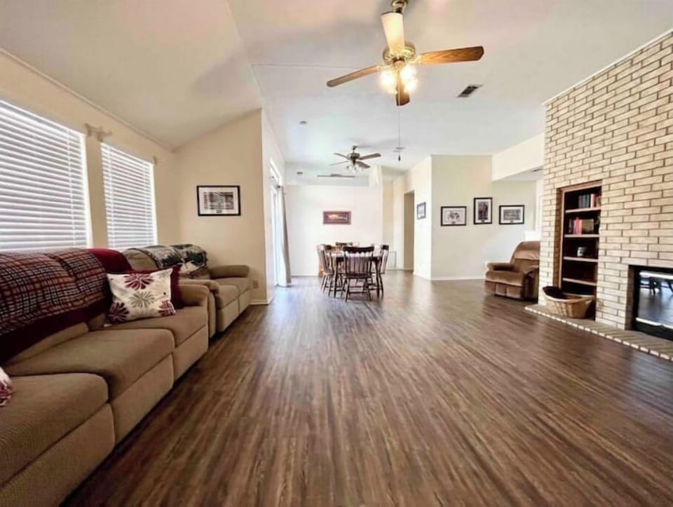 Spacious living room with fireplace and 50" tv