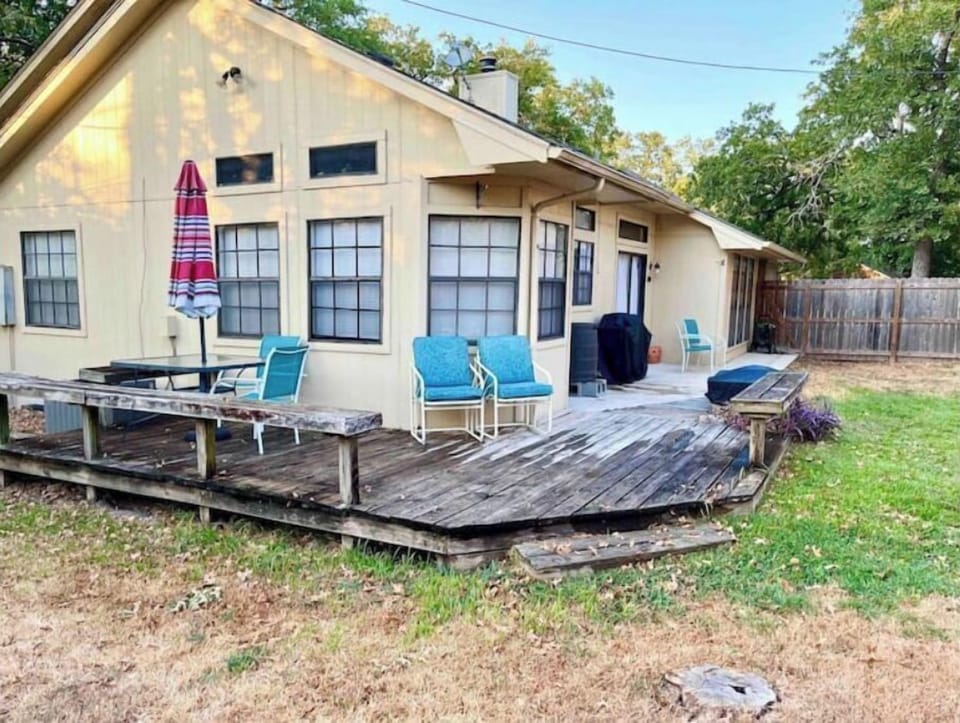 Large wraparound deck with lots of seating. Fenced, private yard.