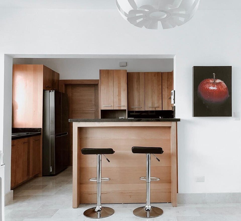 Enjoy casual dining and conversation at the countertop with two stylish stools.  This convenient setup allows for relaxed meals or a cozy spot to sip your morning coffee.  The perfect blend of functionality and comfort for your dining needs.  