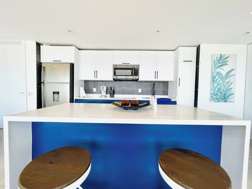 Enjoy casual dining and conversation at the countertop with two sylish stools.  This convenient setup allows for relaxed meals or a cozy spot to sip your morning coffee.  The perfect blend of functionality and comfort for your dining needs.  