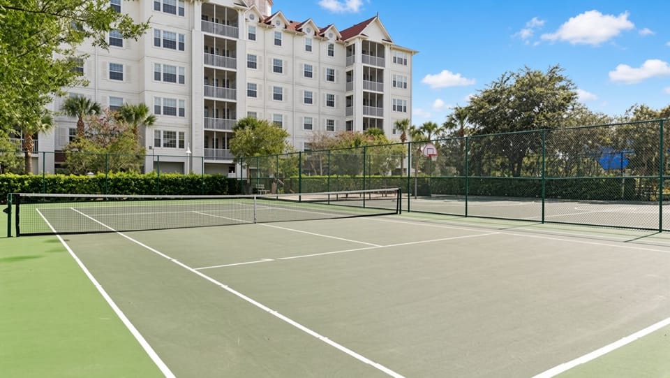 Tennis Courts • Fenced Courts & Villa Backdrop