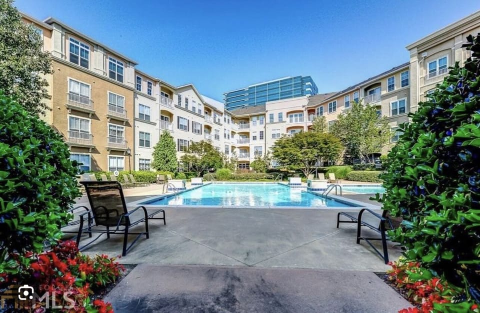 The pool is beautifully landscaped, offering a tranquil escape from the city! 