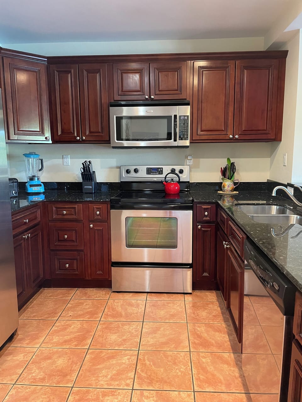 Modern kitchen with full size refridgerator 