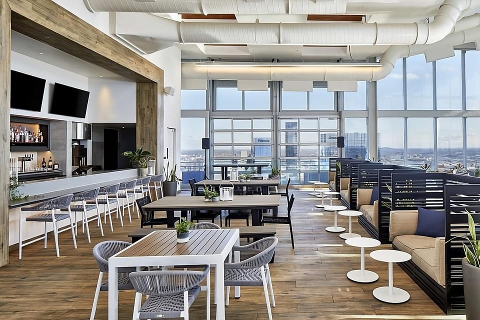 Unwind above the city in a sunlit rooftop lounge.
