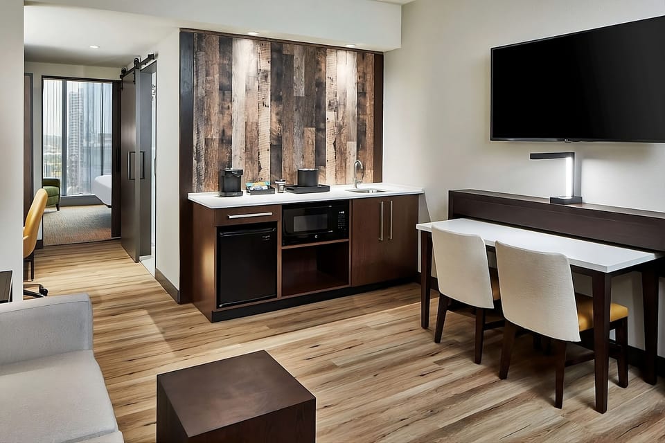 Sip morning coffee from your in-room kitchenette and sink.